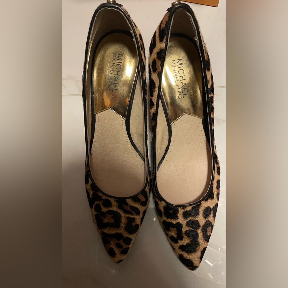 Cheetah pumps Michael Kors used size 8.5 over all good condition gently used
